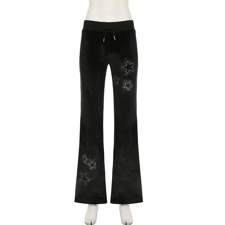 Black velour flare pants with drawstring waist and rhinestone star embellishments