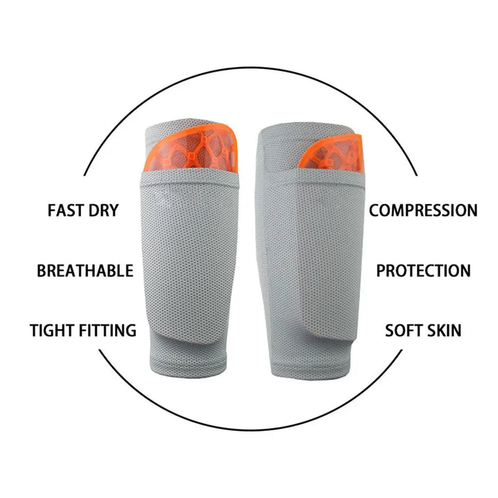 Gray and orange breathable compression shin guards with protective padding and fast dry fabric