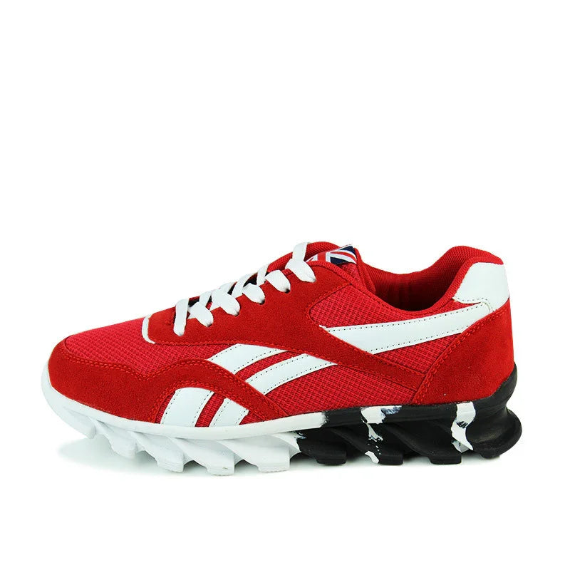 Red and white athletic sneaker with black and white segmented sole on white background