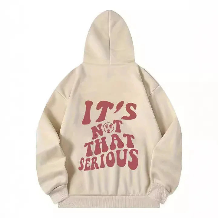 Beige hoodie with pink text saying "IT'S NOT THAT SERIOUS" and small skull design on back