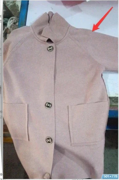 Beige button-up wool coat with two front pockets and a high collar laid flat on a white surface