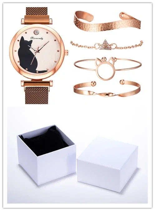 Rose gold cat-themed watch and four matching rose gold bracelets with triangle and paw designs, displayed with open white gift box
