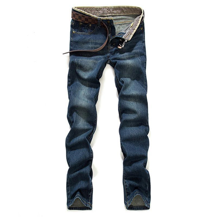 dark blue slim fit men's jeans with faded wash and brown checkered belt on white background
