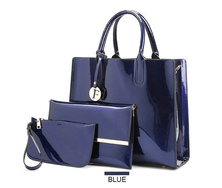 Shiny blue patent leather handbag set with large tote, medium clutch, and small wristlet pouch