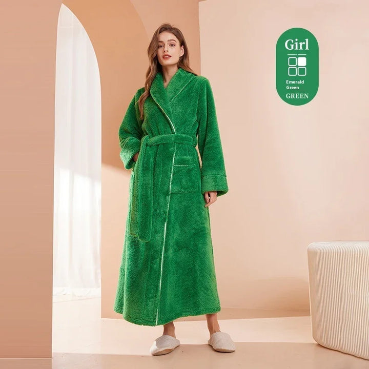 Woman wearing long emerald green plush robe with pockets and belt in modern beige room