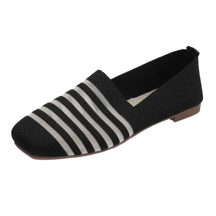 Black and white striped women's flat shoe with knitted fabric upper and brown sole