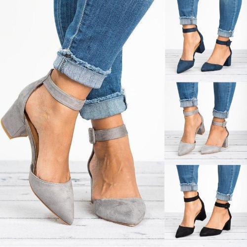 Women's ankle strap block heel shoes in gray, navy, and black worn with rolled-up blue jeans