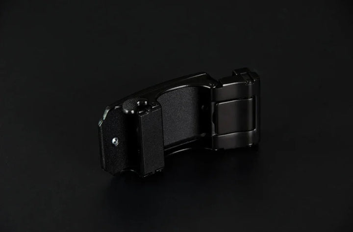 black metal watch clasp buckle isolated on dark background