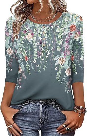 Woman wearing green floral print 3/4 sleeve blouse with button details, paired with blue jeans