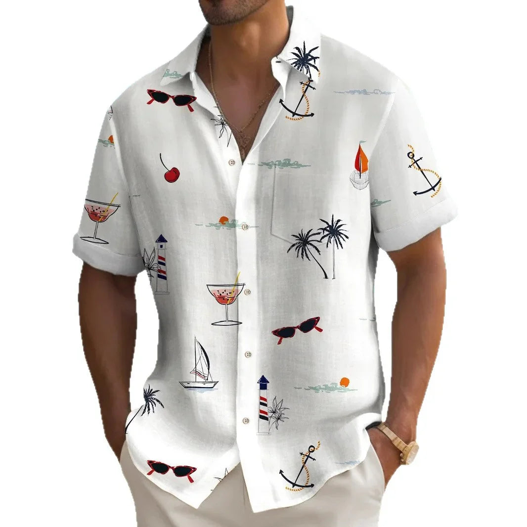 White short-sleeve button-up shirt with nautical print including anchors, palm trees, sailboats, sunglasses, and cocktails