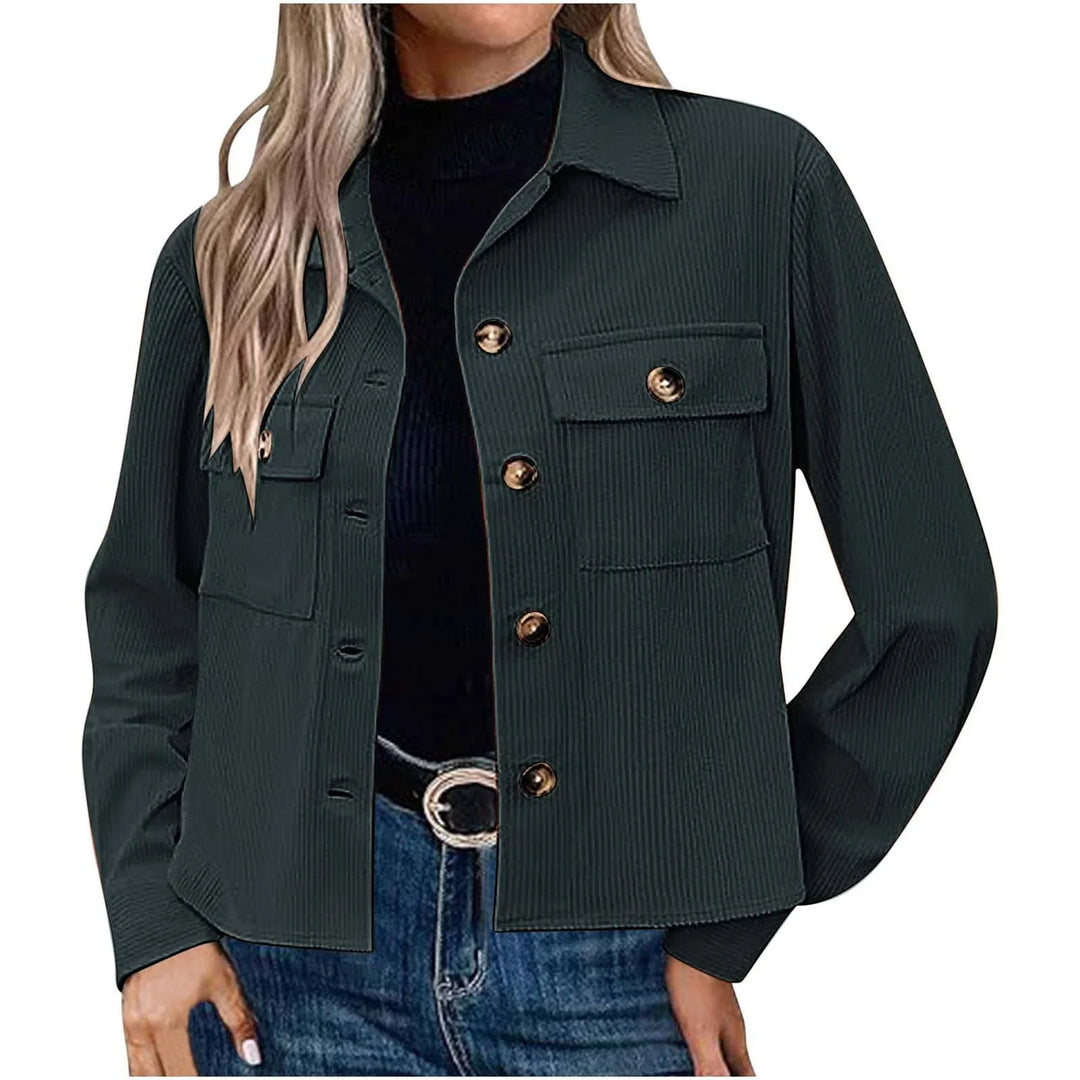 Woman wearing dark green button-up shirt jacket with chest pockets and gold buttons