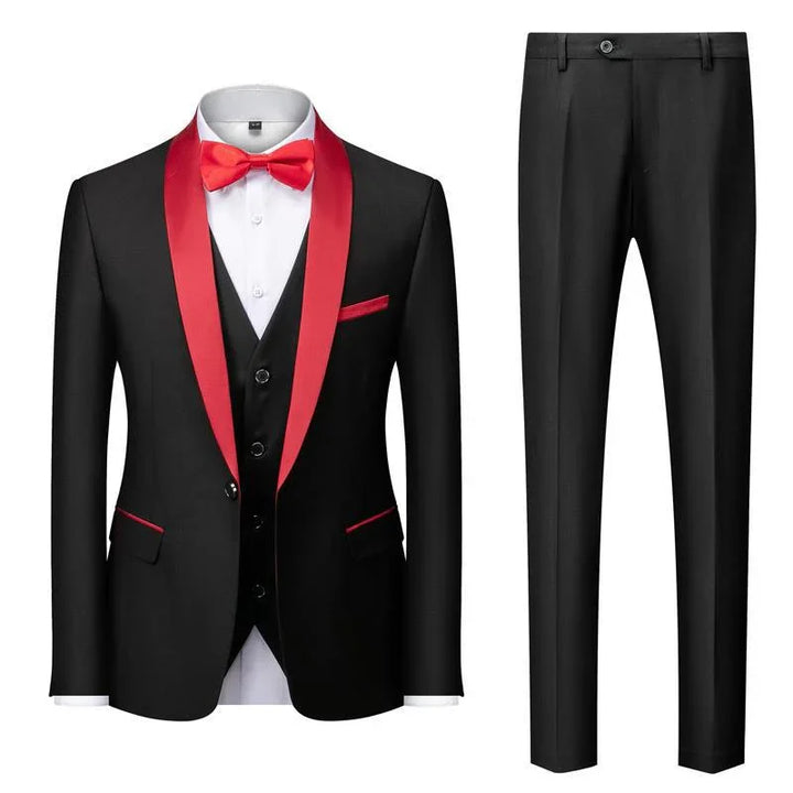 Black tuxedo with red satin lapels, red bow tie, red pocket accents, white shirt, and black trousers