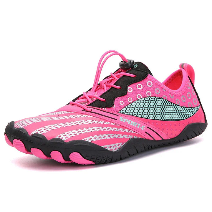 Pink and black lightweight sports shoe with teal honeycomb pattern and elastic lace closure