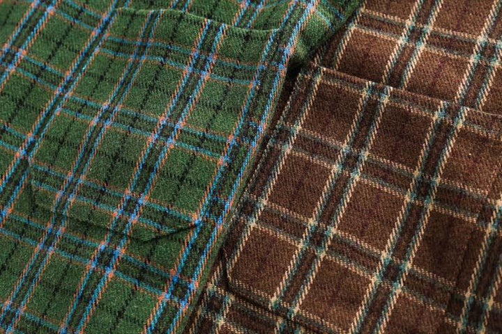 Close-up of green and brown plaid wool fabric with blue and beige check pattern