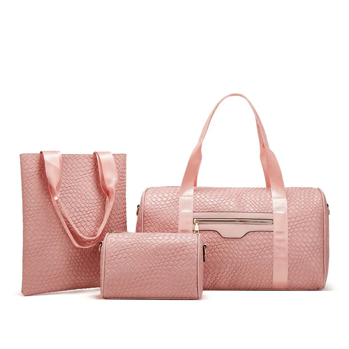 Set of three pink textured travel bags including tote, duffle, and small pouch with satin handles