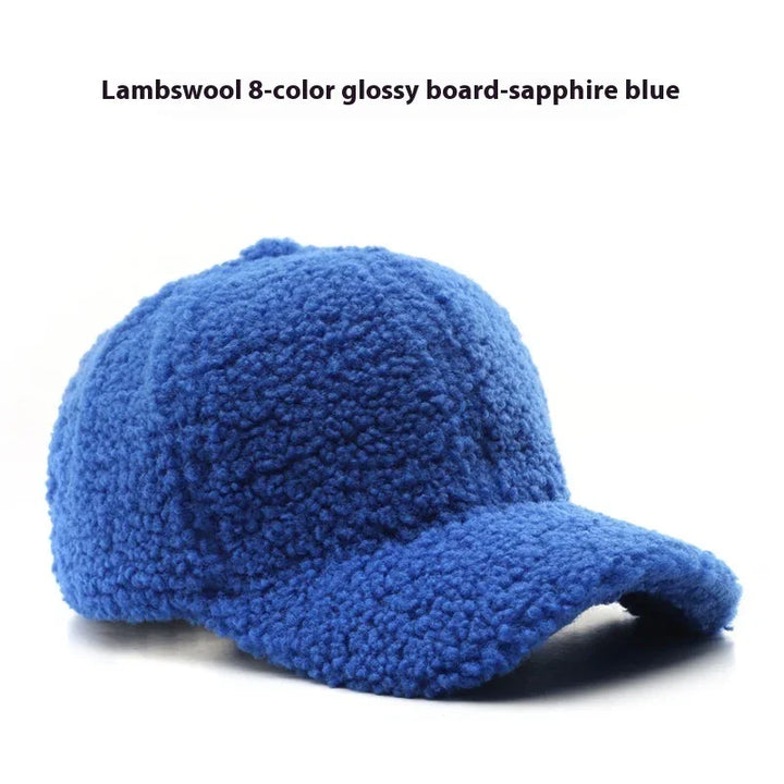 Sapphire blue lambswool baseball cap with textured glossy fabric on white background