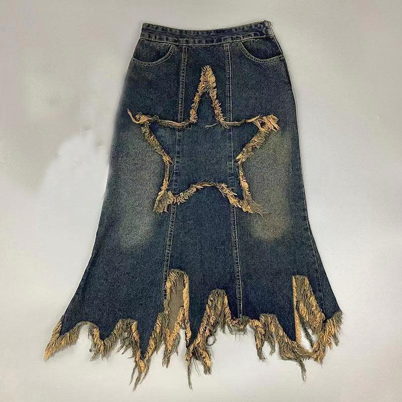 Denim skirt with frayed star cutout and distressed jagged hem on gray background