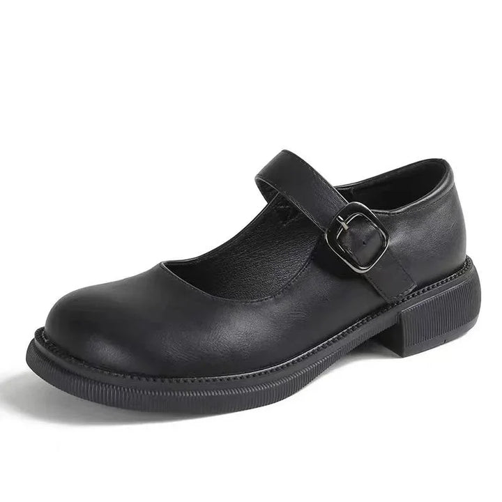 Black leather Mary Jane shoe with adjustable buckle strap and low chunky sole