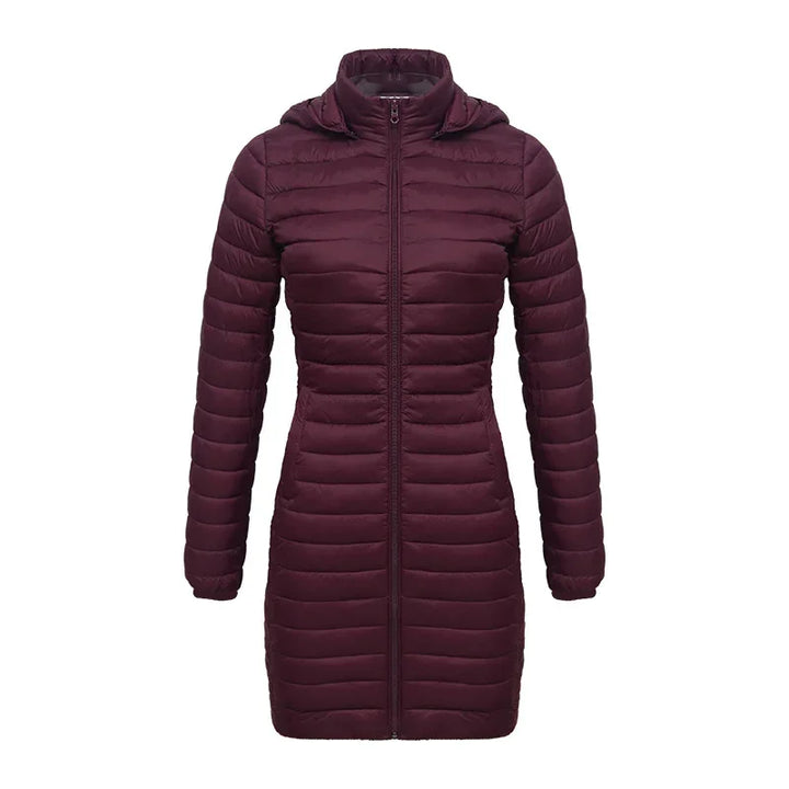 Women's long maroon puffer jacket with hood and front zipper on white background