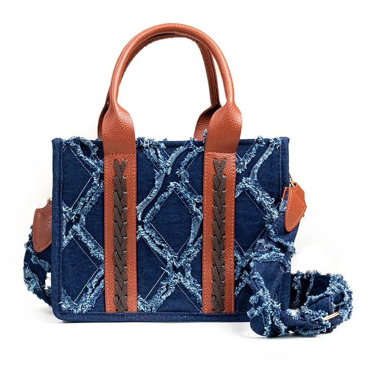 Blue denim handbag with frayed diamond pattern, brown leather handles, and detachable strap