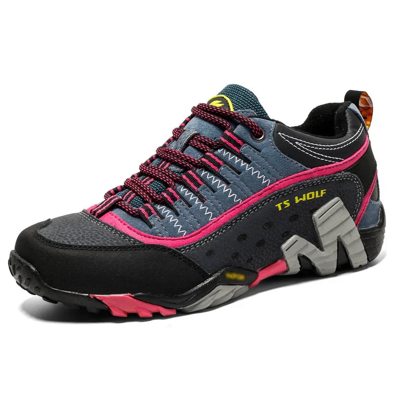 TS WOLF hiking shoe with gray and black upper, pink accents, and durable sole for outdoor trekking