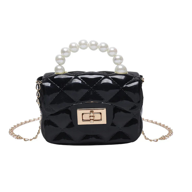 Black patent leather quilted handbag with gold clasp, pearl handle, and gold chain strap