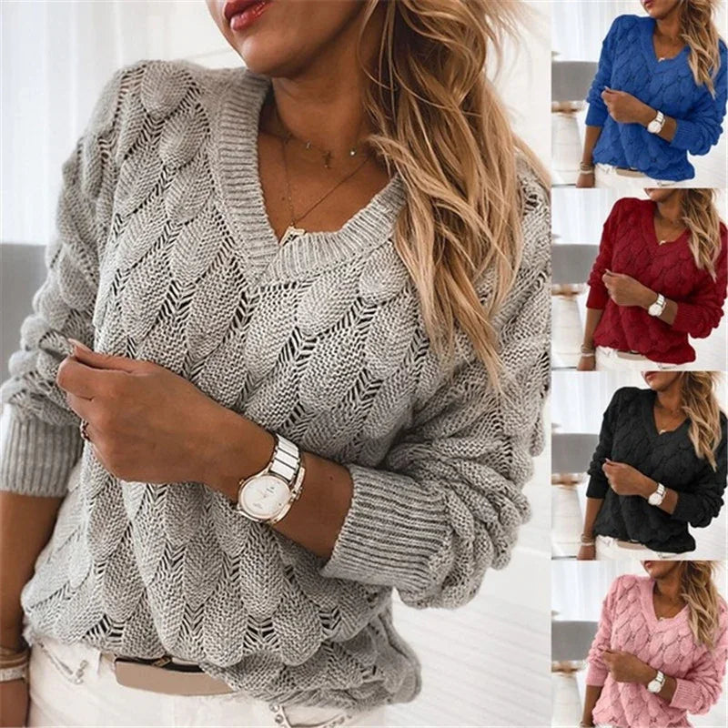 Women wearing cable-knit V-neck sweaters in gray, blue, red, black, and pink, styled with white pants