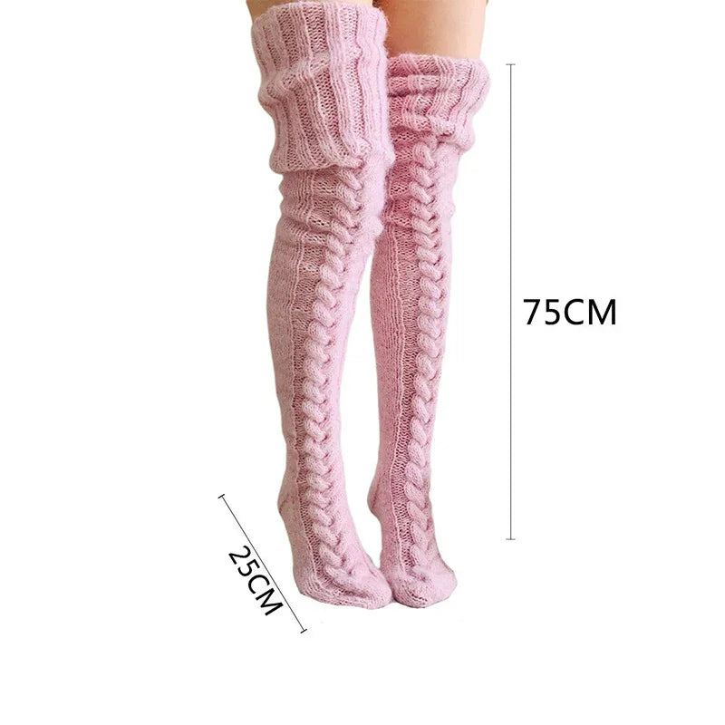 Pink knitted thigh-high cable knit socks measuring 75cm length and 25cm foot width