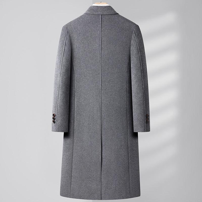 Back view of a gray wool men's overcoat with buttoned cuffs hanging on a wooden hanger
