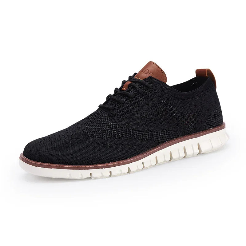 Black knitted casual men's shoe with white flexible sole and brown leather accents