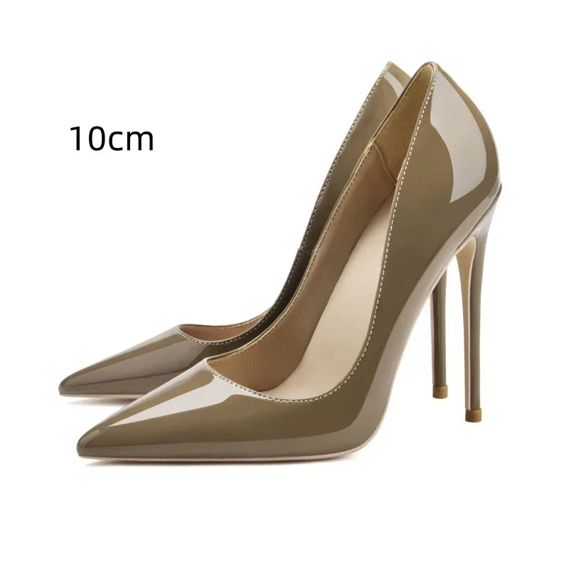 Glossy beige pointed-toe high heel pumps with 10cm stiletto heels on white background