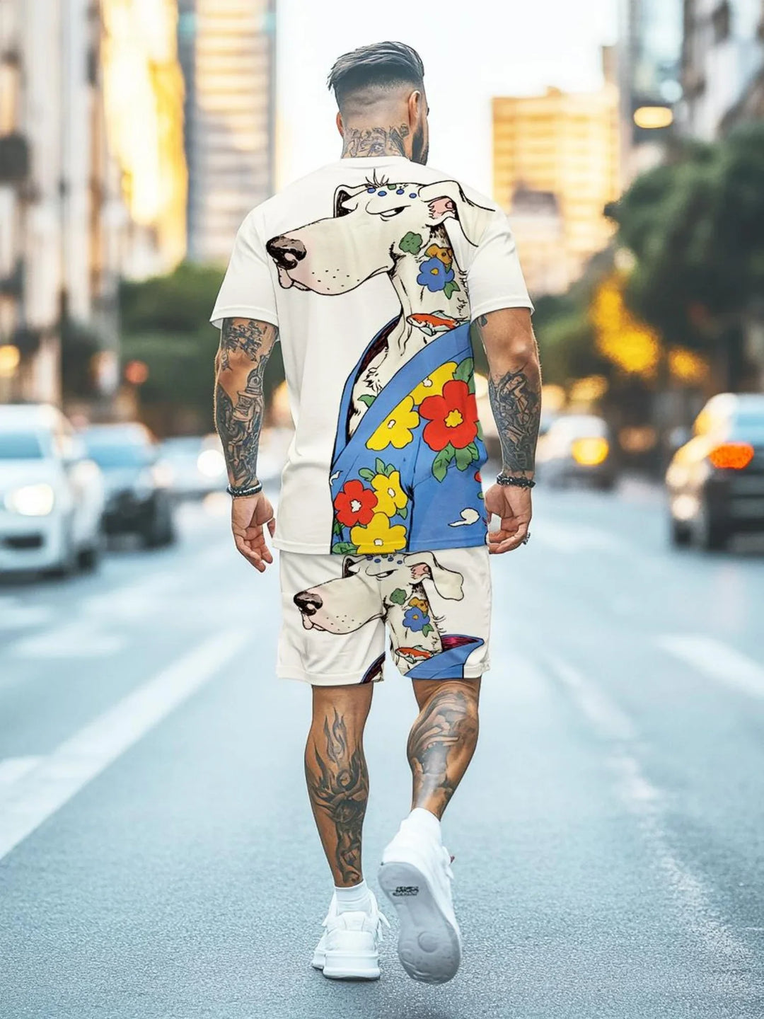 Man with tattoos wearing colorful dog-themed printed shorts and t-shirt walking down city street