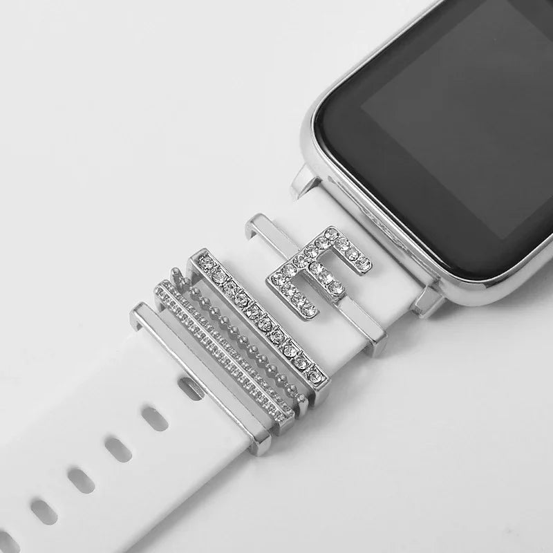 White smartwatch with silver rhinestone-encrusted letter and bars on band strap