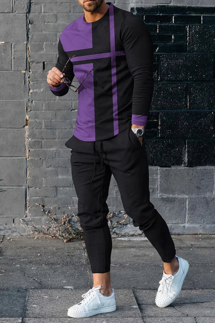 Man wearing black and purple long-sleeve shirt, black joggers, white studded sneakers, holding sunglasses