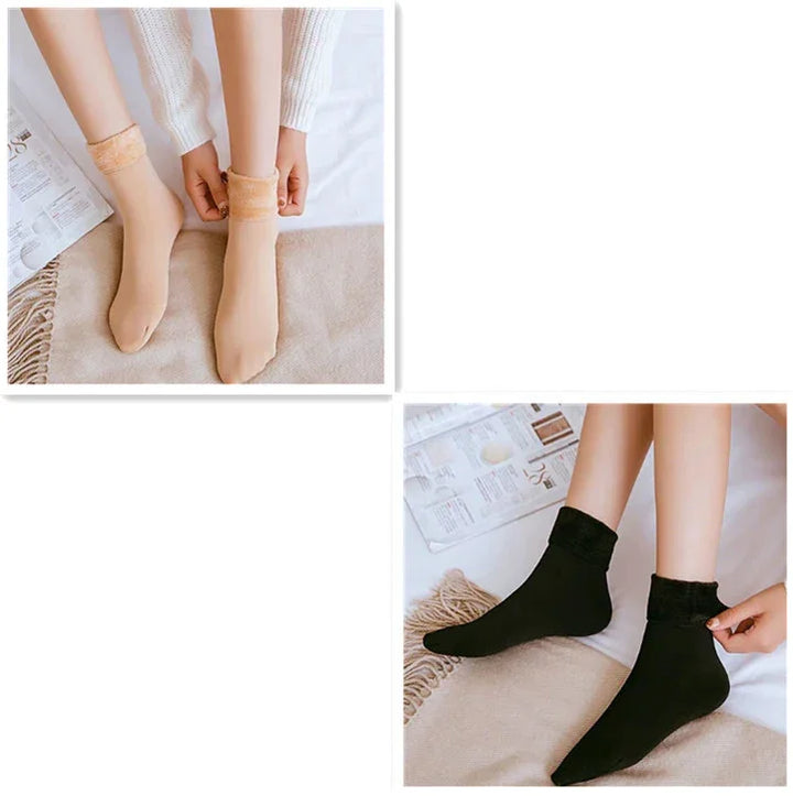 Close-up of feet wearing beige and black cozy ribbed ankle socks on beige textured fabric with magazine