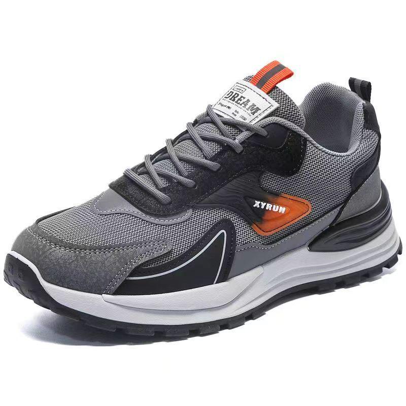 Gray and black athletic sneaker with orange accents and mesh fabric, labeled XYRUN