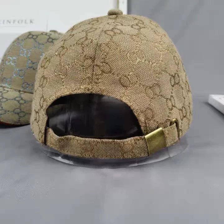 Back view of beige designer baseball cap with signature monogram pattern and adjustable strap