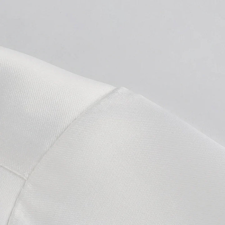Close-up of white fabric with detailed stitching and smooth texture