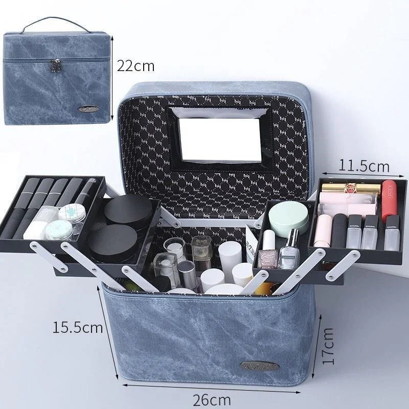 Blue fabric makeup organizer box with mirror, multiple compartments holding cosmetics, dimensions shown