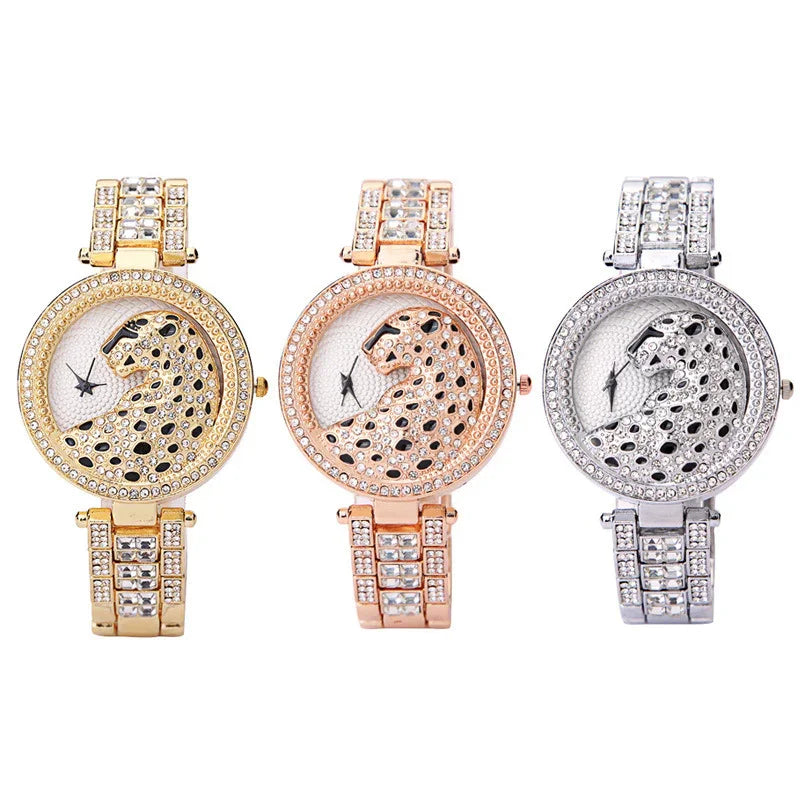 Three luxury wristwatches with jeweled leopard design faces in gold, rose gold, and silver tones