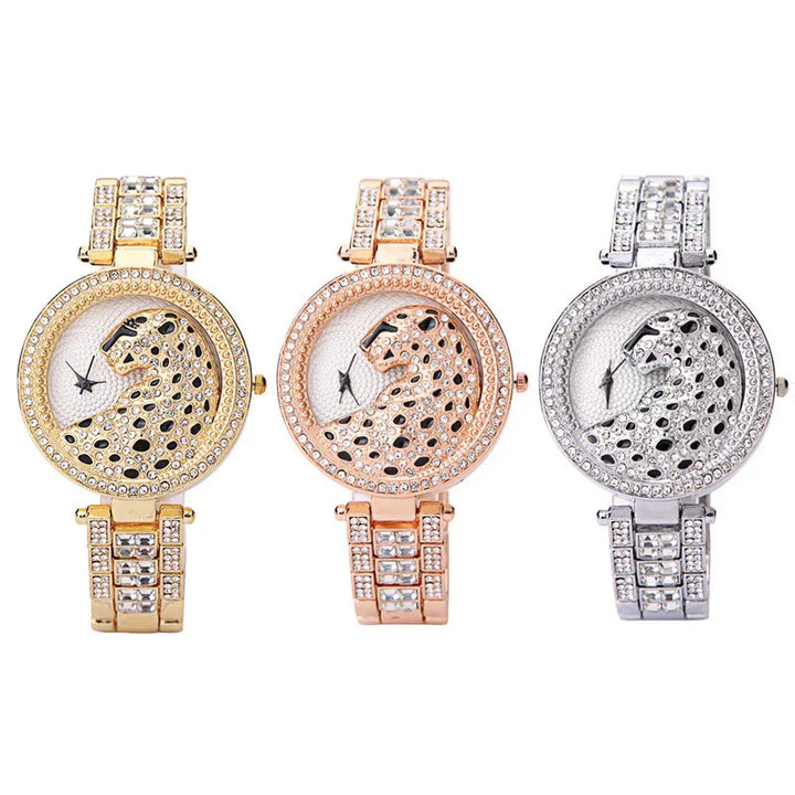 Three luxury wristwatches with jeweled leopard design faces in gold, rose gold, and silver tones