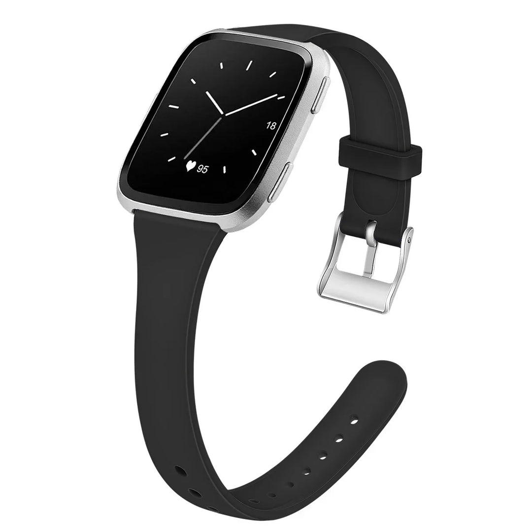 Black fitness smartwatch with silver frame showing heart rate and analog clock on screen