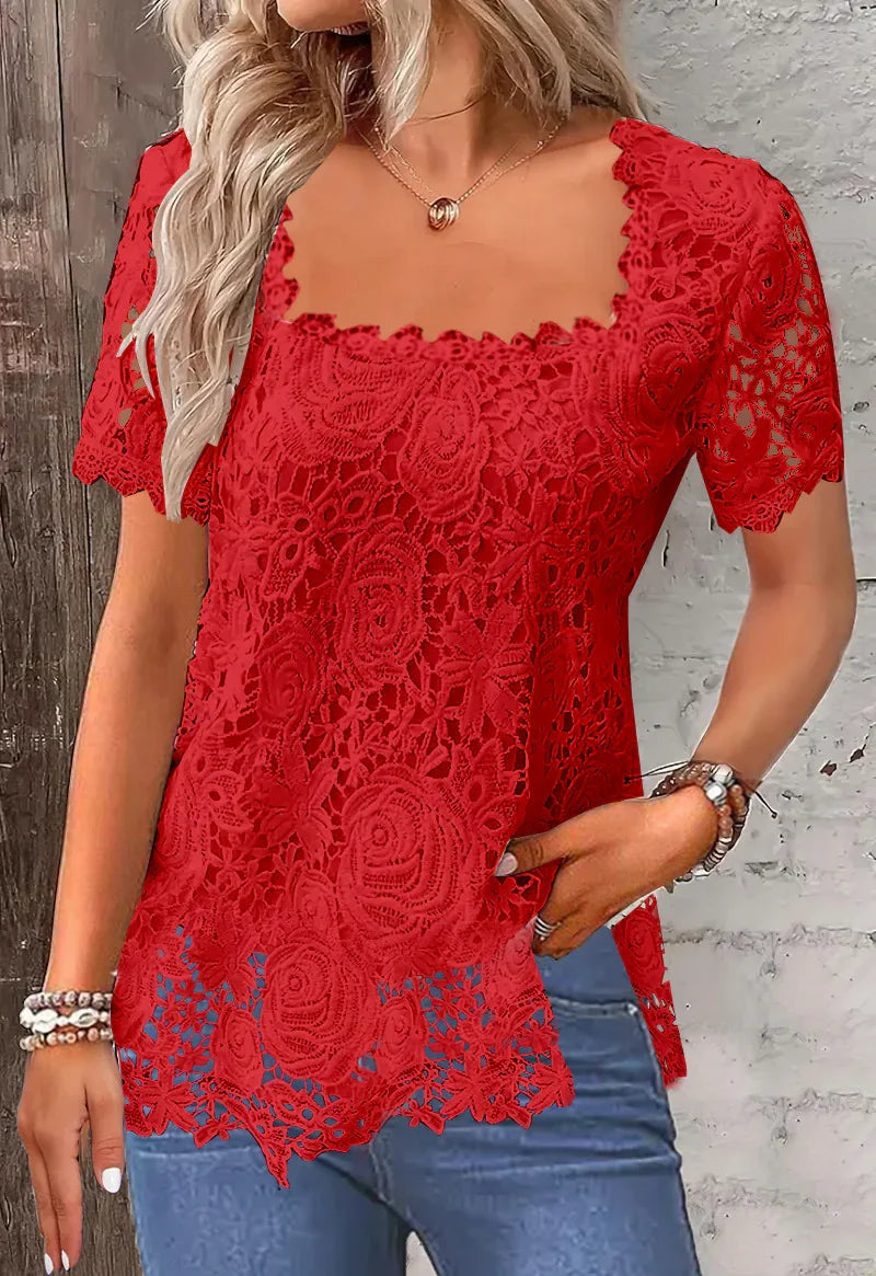 Woman wearing red floral lace short sleeve blouse paired with blue jeans and bracelets