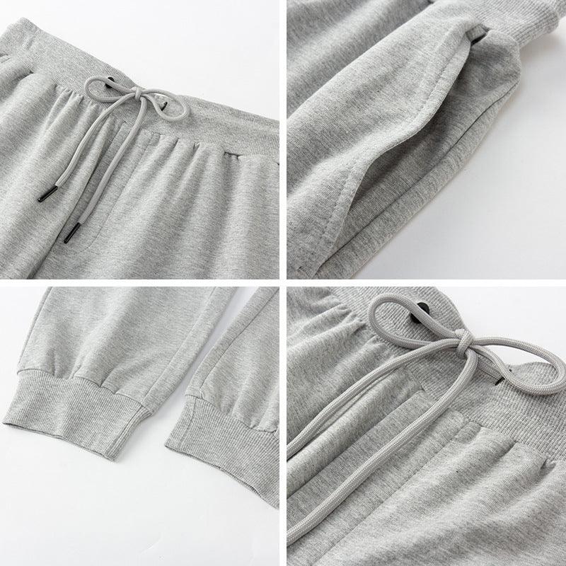 Close-up details of gray sweatpants showing drawstring waist, side pockets, and ribbed cuffs