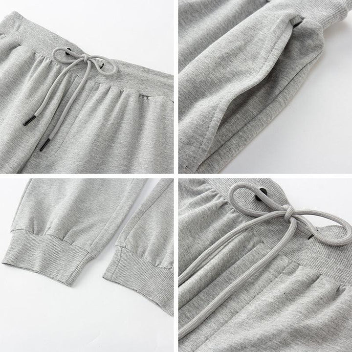 Close-up details of gray sweatpants showing drawstring waist, side pockets, and ribbed cuffs