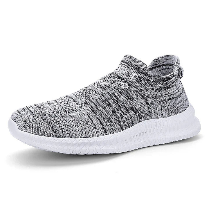 Grey and white knit slip-on athletic shoe with textured white sole