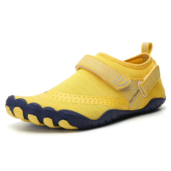 Yellow barefoot minimalist outdoor shoe with black toe soles and adjustable strap
