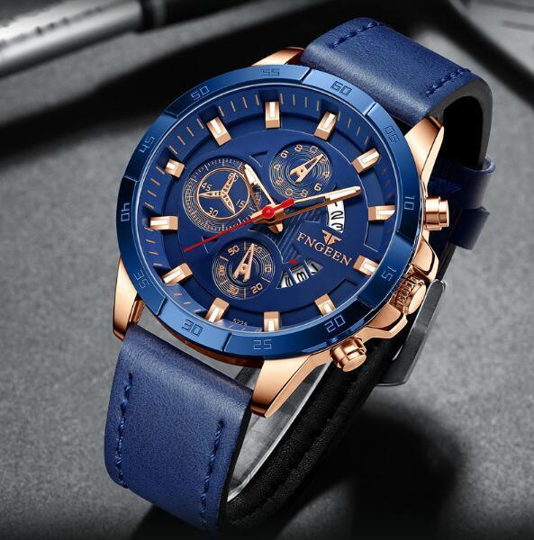 FENGEN blue chronograph wristwatch with rose gold case and blue leather strap on gray surface