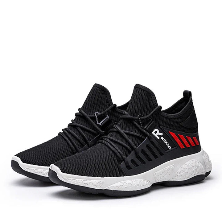 Black athletic sneakers with white textured sole, red stripes, and stylistic laces