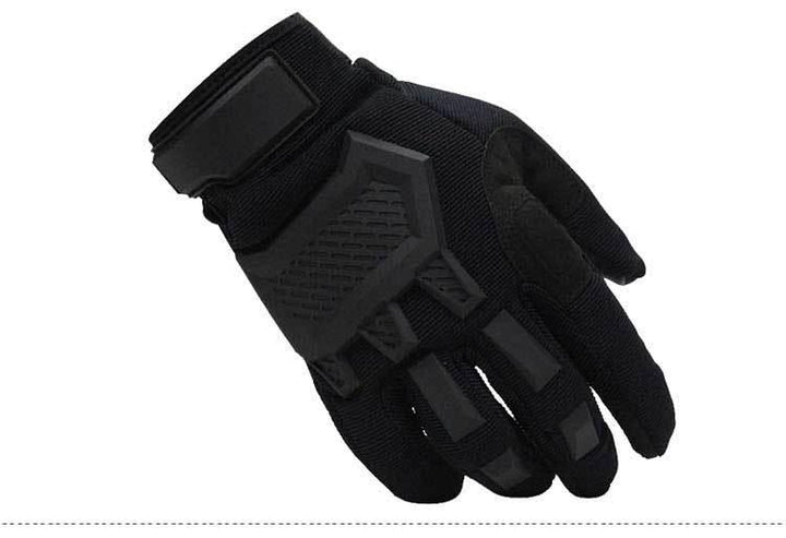 Black tactical glove with padded knuckles and wrist strap on white background